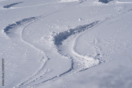 Fresh ski tracks in the snow at Mount Rigi. Photo taken April 14th, 2021, Rigi Kulm, Switzerland.