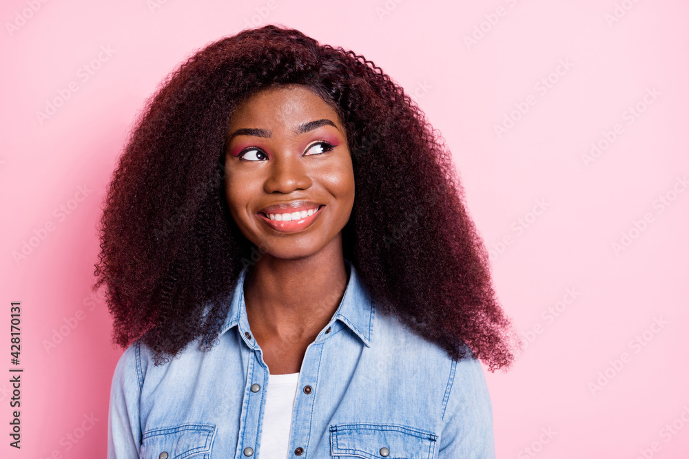 Portrait of attractive curious cheerful wavy-haired girl thinking copy space isolated over pink pastel color background