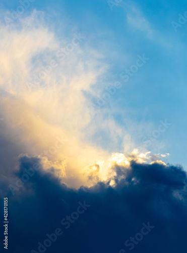 Light and dark clouds in the dramatic sky during sunset