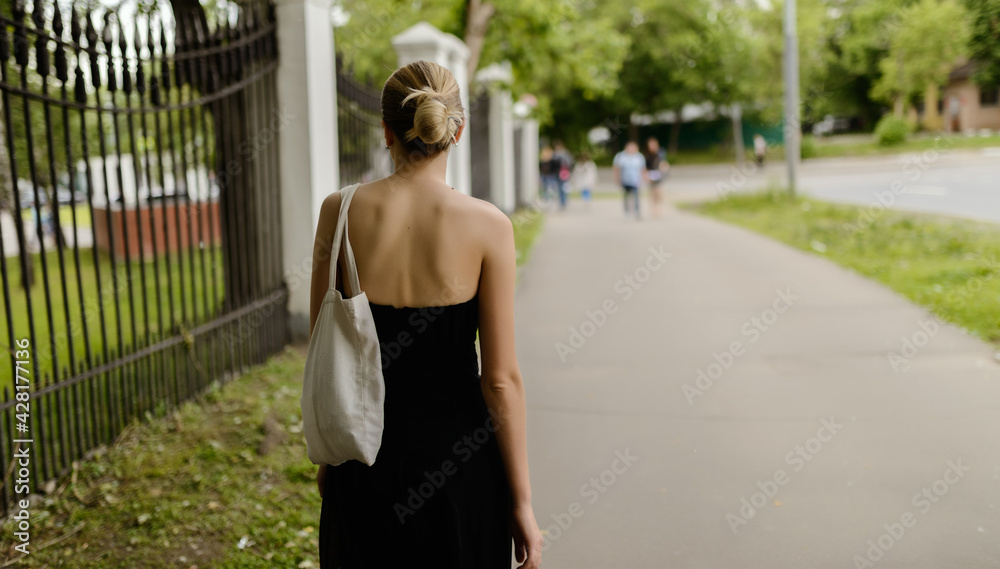 Portrait of beautiful young woman - she run down the street.