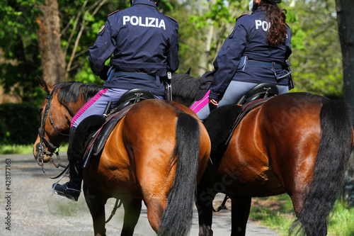 Pair of policemen on horseback patrolling the Villa Borghese in Rome