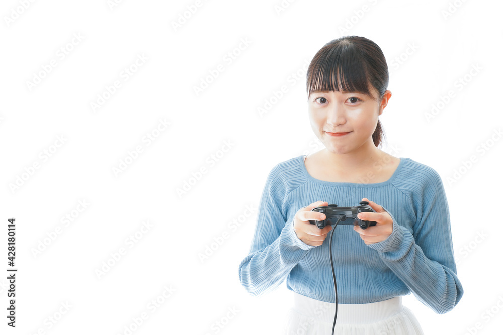 テレビゲームをプレイする若い女性 テレビゲームをプレイする若い女性