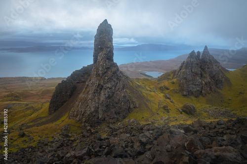 Dark, moody, ominous landscape at the dramatic and iconic rock pinnacle Old Man of Storr on the Isle of Skye, Scotland.