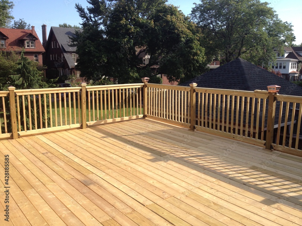Construction of large wood deck on flat roof garage Stock Photo Adobe
