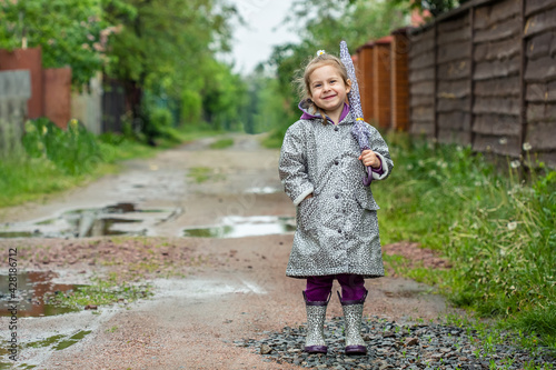 summer walk in the rain little girl with an umbrella