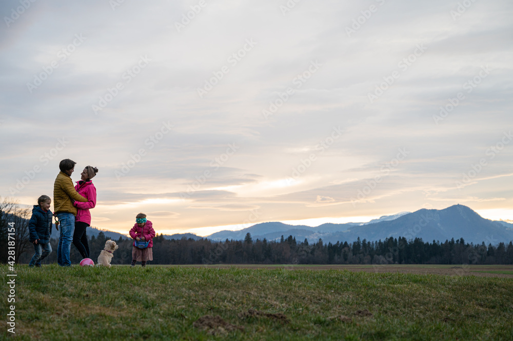 Beautiful family moment outside in a green meadow Beautiful family moment outside in a green meadow