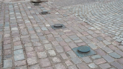 Wallpaper Mural Automatic pop up bollards to restrict the entry of vehicles mounted in old paving stones. Road safety traffic control equipment in action Torontodigital.ca