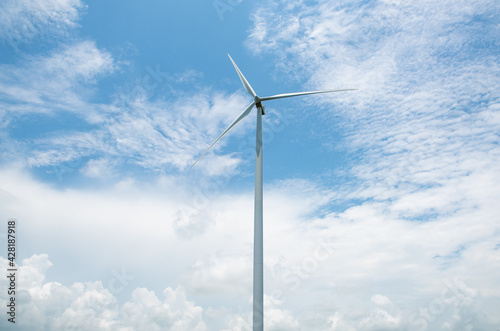 Wind turbines generate electricity which is clean energy to protect the environment. © watchara