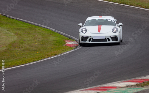 A shot of a racing car as it circuits a track. © SnapstitchPhoto