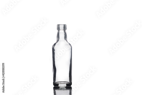 Empty small glass bottle isolated on white background.