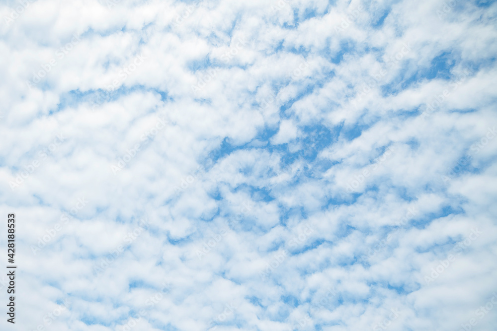 Blue sky background with clouds. White clouds at the sky. Blue sky background with clouds. White clouds at the sky.