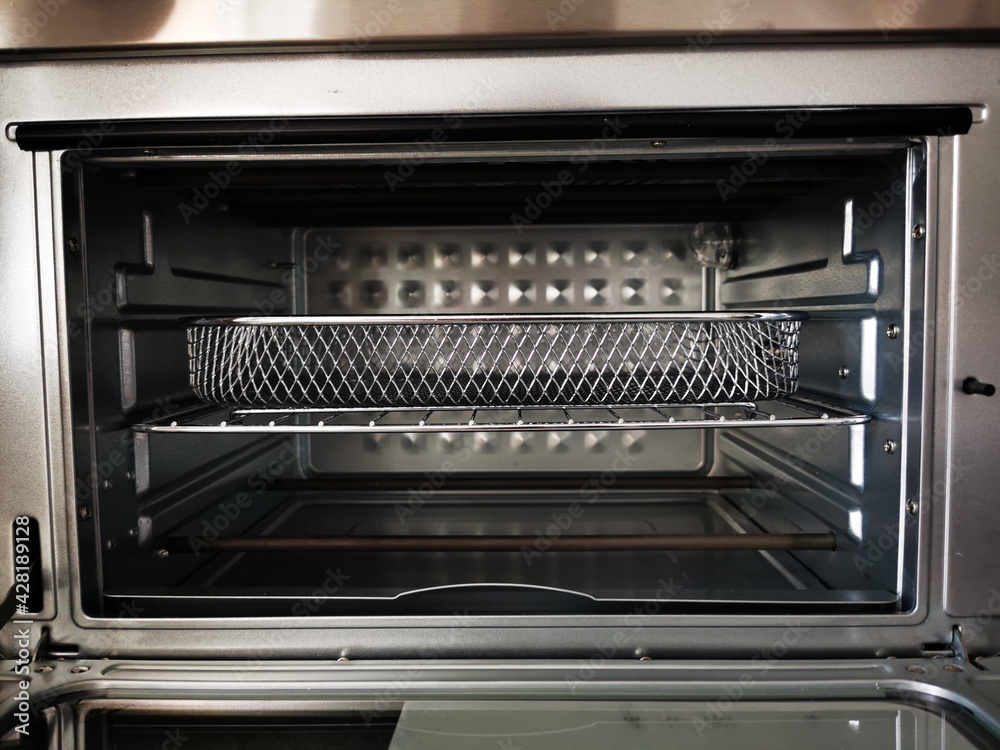 Empty oven with basket for grilling, baking Empty oven with basket for grilling, baking