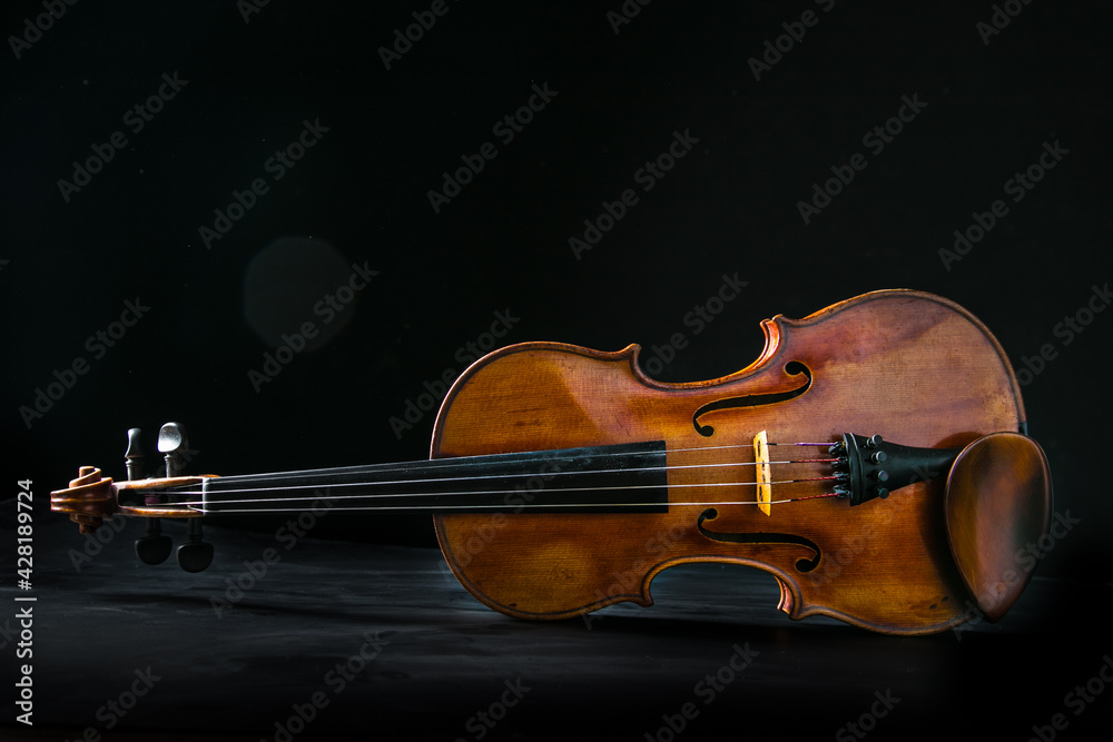 Fototapeta premium Close up of a violin isolated on a black background