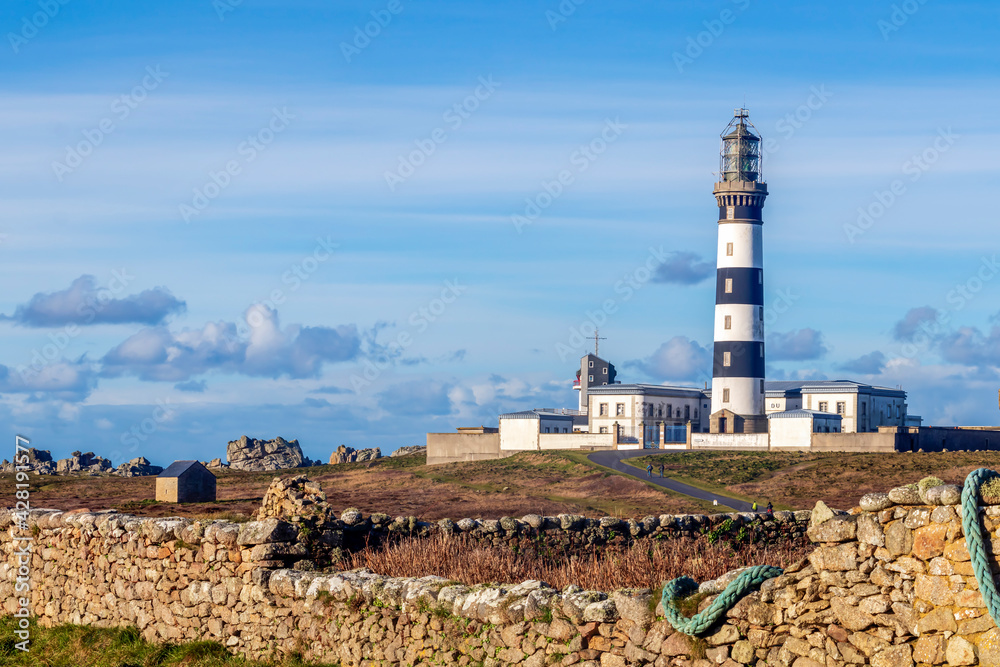 Lighthouse and Beacon of Ouessant, the island of Ushant, in Brittany, french rocky beach in northern France, Finistere