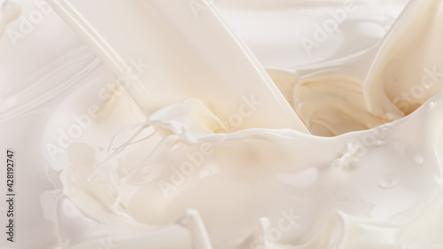 Splashing milk on white background