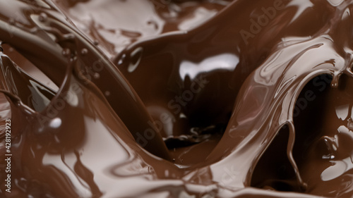 Splashing hot chocolate texture, close-up.