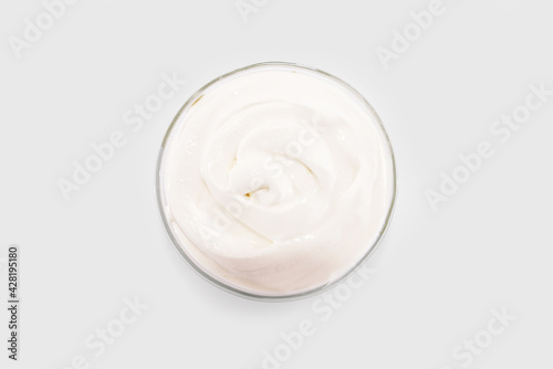 sour cream in a glass plate, mayonnaise, yogurt isolated on a white background.