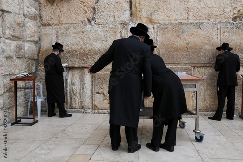 Jerusalem: Men praying at the western wall or wailing wall in the old city