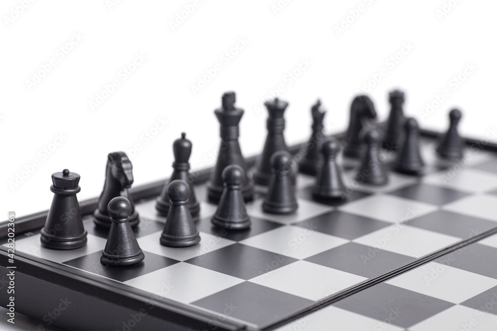 Chess on the chessboard on white background