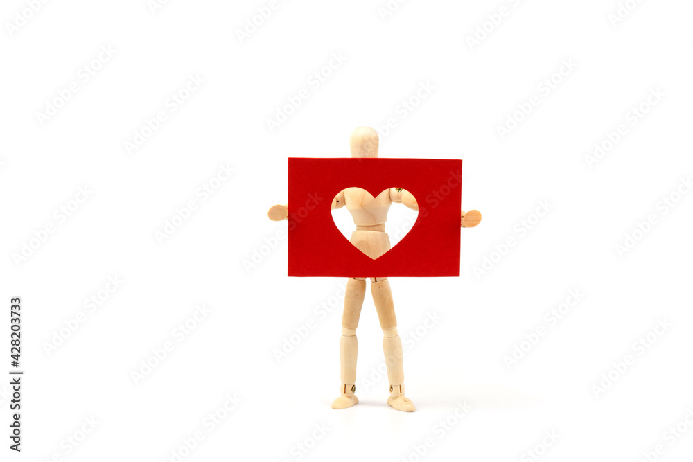 Wood man figure holding  shape of  heart on white background with copy space. Love concept for valentines day.