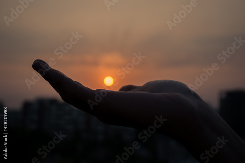 hand holding a sun