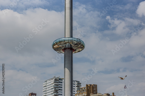 Beautiful view of  Brighton beach sea, sand and British Airways i360 in the background. Popular landmark of the city.	