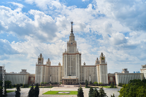 Low angle view of the Moscow State University. Clouds are moving on the sky on background photo