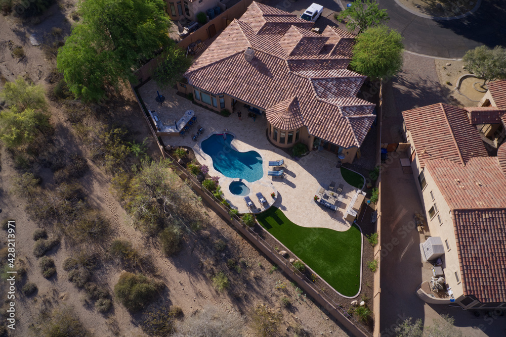 A high definition aerial view of a desert landscaped backyard in Arizona. A high definition aerial view of a desert landscaped backyard in Arizona.