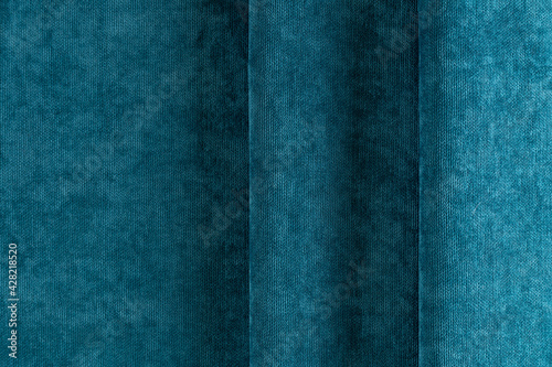 curtain fabric cyan-colored canvas, draped with folds, background