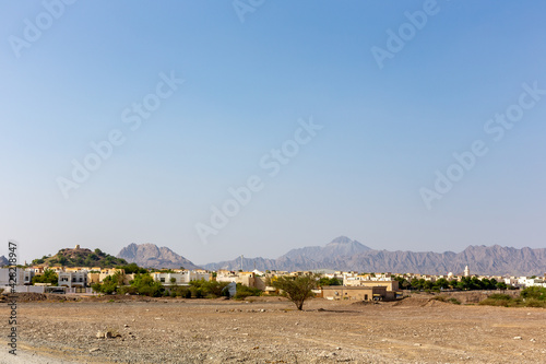 Hatta Town with residential buildings landscape, Hajar Mountains in the background. United Arab Emirates.