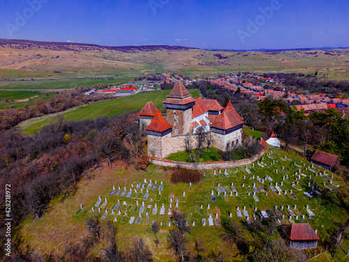 Aerial view of medieval fortified church at Viscri, Romania. photo