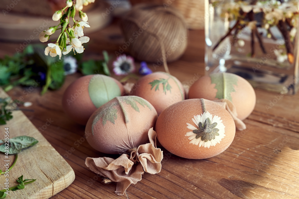 Easter eggs with plants attached to them with old nylons - preparation for dyeing with onion peels Easter eggs with plants attached to them with old nylons - preparation for dyeing with onion peels