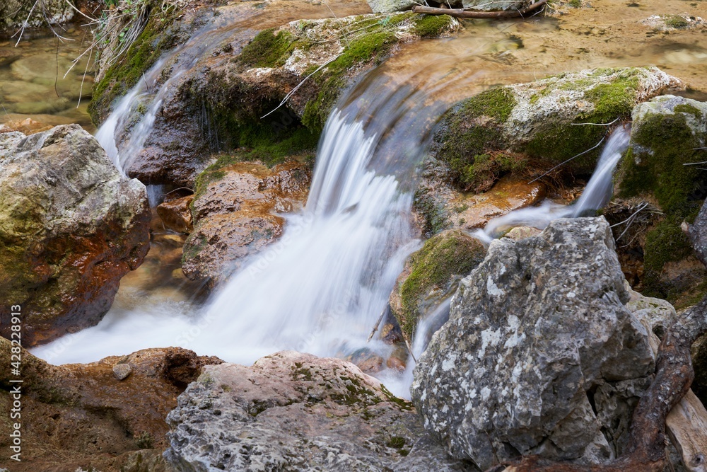 Waterfall at the birth of the Mundo River on Riopar, Albacete, Spain Waterfall at the birth of the Mundo River on Riopar, Albacete, Spain