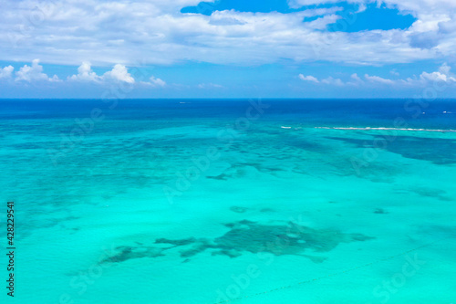 Drone photo of a white sand beach and clear blue water in Cancun  Mexico