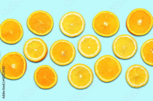 Sliced oranges and lemons close up