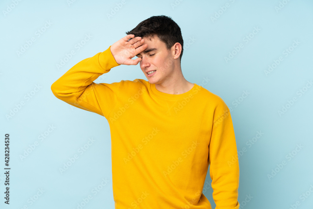 Teenager caucasian handsome man isolated on purple background with tired and sick expression