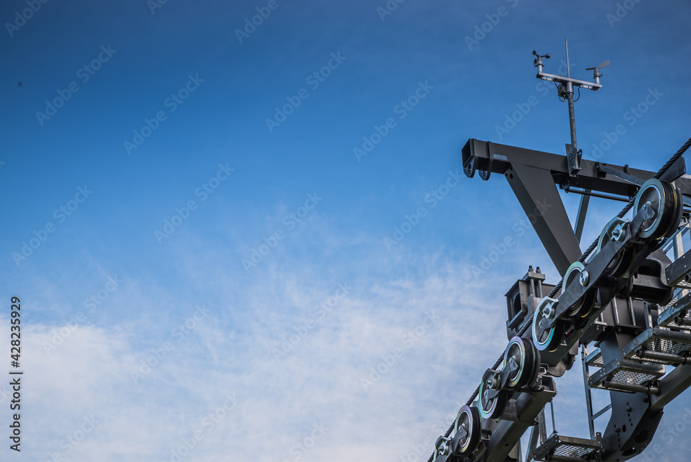 Queenstown gondola ski lift with sky in background