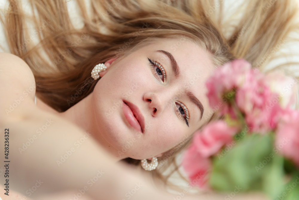 young white woman blonde with pink flowers