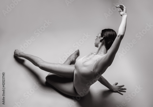 Beautiful dancer posing in studio. Woman dance contemporary. Black and white photography