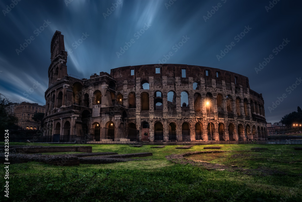 The Colosseum (Coliseum) at night. Rome, Italy. The Colosseum or Coliseum also known as the Flavian Amphitheatre or Colosseo, is an oval amphitheatre in the centre of the city of Rome
