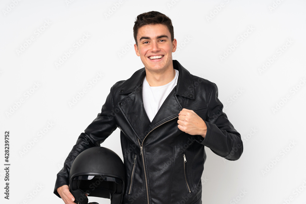 Man holding a motorcycle helmet isolated on white background celebrating a victory Man holding a motorcycle helmet isolated on white background celebrating a victory
