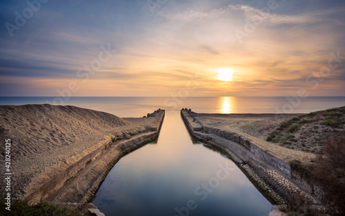 Sunset in Foce del duca, Rio Martino, Latina, Italy photo