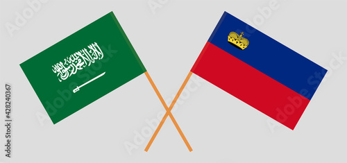 Crossed flags of Liechtenstein and the Kingdom of Saudi Arabia. Official colors. Correct proportion