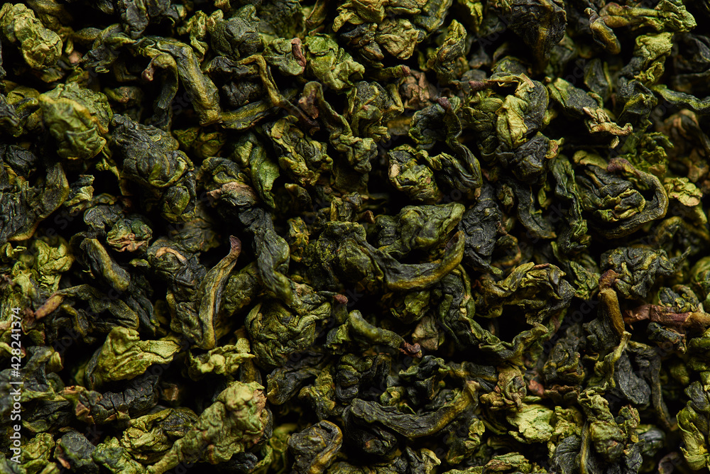 Green tea leaves texture as a background.