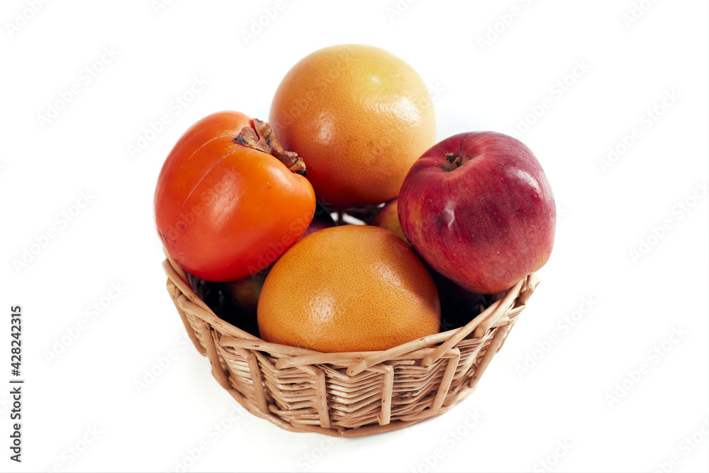 Fruit in a basket isolated on white background