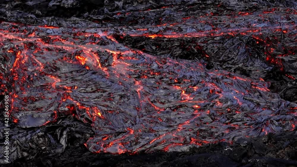 Large molten lava flow orange and red Iceland 2021