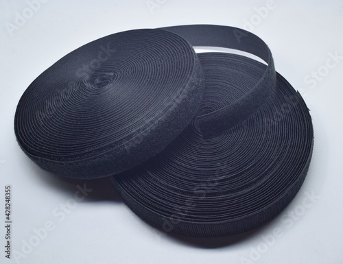 Bild auf Leinwand Rolls of Velcro tape strips isolated on white background.