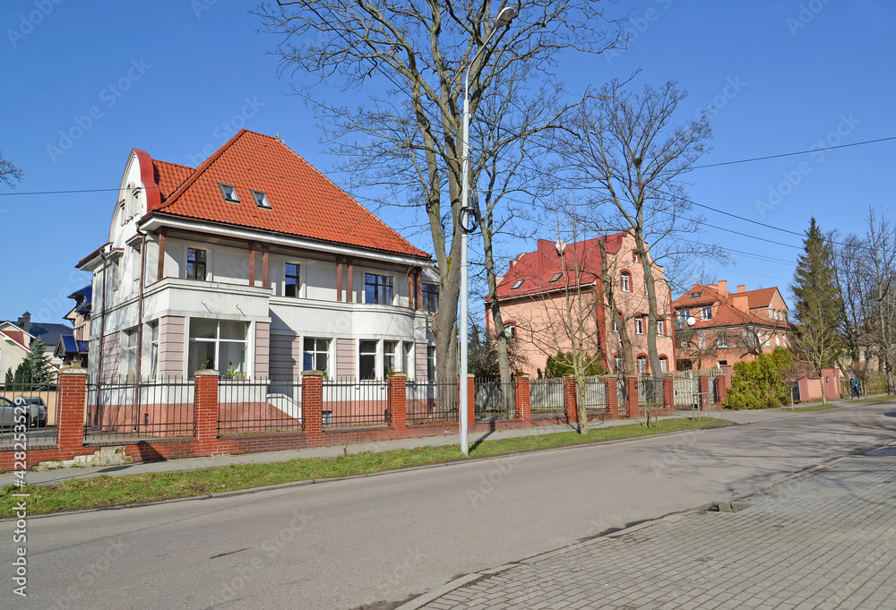 Villas on Kashtanovaya Alley street on a sunny spring day. Kaliningrad