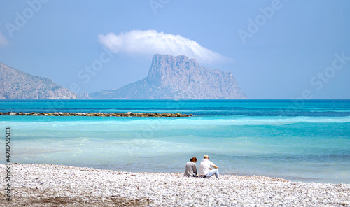 ALTEA, SPAIN - ABRIL 13, 2021: Couple enjoying sea views in Altea photo