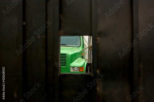 Hidden Green Shipping Truck